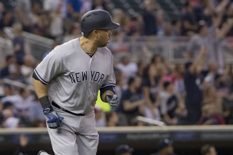 Jun 17, 2016; Minneapolis, MN, USA; New York Yankees right fielder Carlos Beltran (36) watches his two run home run leave the park as he rounds first base in the first inning against the Minnesota Twins at Target Field. Mandatory Credit: Jesse Johnson-USA TODAY Sports