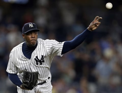 Jul 18, 2016; Bronx, NY, USA; New York Yankees relief pitcher Aroldis Chapman (54) throws to first base to check on a runner agaiinst the Baltimore Orioles during the ninth inning at Yankee Stadium. Mandatory Credit: Adam Hunger-USA TODAY Sports