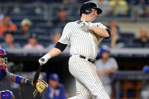 Jun 27, 2016; Bronx, NY, USA; New York Yankees catcher Brian McCann (34) hits an RBI single against the Texas Rangers during the fifth inning at Yankee Stadium. Mandatory Credit: Brad Penner-USA TODAY Sports