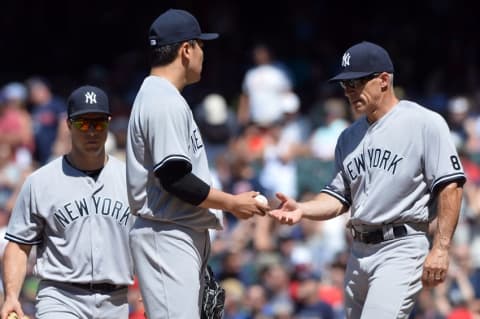 Jul 10, 2016; Cleveland, OH, USA; New York Yankees manager Joe Girardi (28) removes starting pitcher Masahiro Tanaka (19) from the game during the fifth inning at Progressive Field. Mandatory Credit: Ken Blaze-USA TODAY Sports