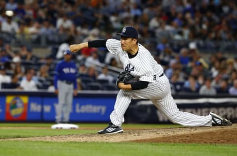 Jun 29, 2016; Bronx, NY, USA; New York Yankees starting pitcher Masahiro Tanaka (19) delivers a pitch against the Texas Rangers in the sixth inning at Yankee Stadium. Mandatory Credit: Noah K. Murray-USA TODAY Sports