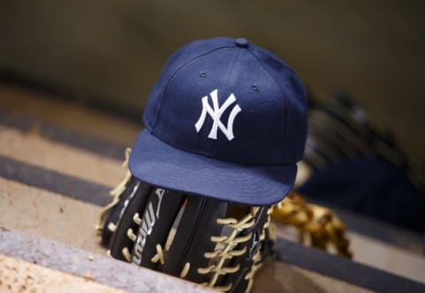 May 18, 2016; Phoenix, AZ, USA; Detailed view of a New York Yankees hat and baseball glove against the Arizona Diamondbacks at Chase Field. Mandatory Credit: Mark J. Rebilas-USA TODAY Sports