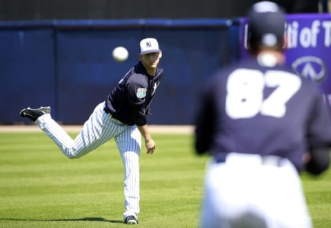 Feb 19, 2016; Tampa, FL, USA; New York Yankees pitcher James Kaprielian (90) and pitcher Brady Lail (87) work out at George M. Steinbrenner Field. Mandatory Credit: Kim Klement-USA TODAY Sports