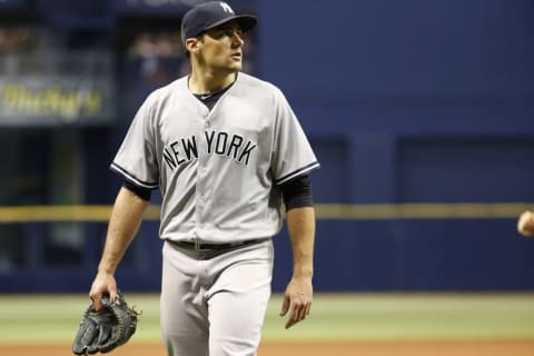 Jul 30, 2016; St. Petersburg, FL, USA; New York Yankees starting pitcher Nathan Eovaldi (30) looks on at the end of the first inning against the Tampa Bay Rays at Tropicana Field. Mandatory Credit: Kim Klement-USA TODAY Sports