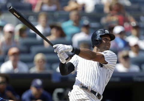 Aug 13, 2016; Bronx, NY, USA; New York Yankees right fielder Aaron Hicks (31) hits a three-run home run during the fifth inning against the Tampa Bay Rays at Yankee Stadium. Mandatory Credit: Adam Hunger-USA TODAY Sports