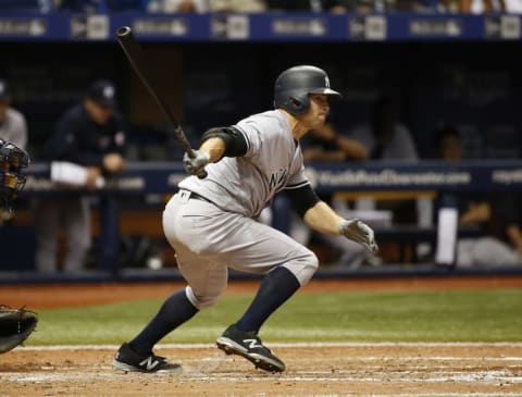 Sep 20, 2016; St. Petersburg, FL, USA; New York Yankees left fielder Brett Gardner (11) hits a RBI single during the seventh inning against the Tampa Bay Rays at Tropicana Field. Mandatory Credit: Kim Klement-USA TODAY Sports