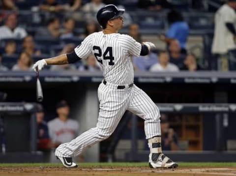 Sep 27, 2016; Bronx, NY, USA; New York Yankees catcher Gary Sanchez (24) hits a two-run home run during the first inning against the Boston Red Sox at Yankee Stadium. Mandatory Credit: Adam Hunger-USA TODAY Sports