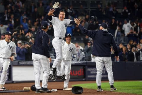 Sep 28, 2016; Bronx, NY, USA; New York Yankees first baseman Mark Teixeira (25) celebrates with teammates after hitting a walk off grand slam against the Boston Red Sox during the ninth inning at Yankee Stadium. Mandatory Credit: Brad Penner-USA TODAY Sports