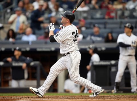 Oct 2, 2016; Bronx, NY, USA; New York Yankees catcher Brian McCann (34) hits a home run in the bottom of the fourth inning against the Baltimore Orioles at Yankee Stadium. It was the 20th home run of the season for McCann. Mandatory Credit: Danny Wild-USA TODAY Sports