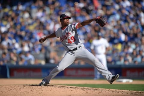 Oct 11, 2016; Los Angeles, CA, USA; Washington Nationals starting pitcher Reynaldo Lopez (49) delivers a pitch in the fifth inning against the Los Angeles Dodgers during game four of the 2016 NLDS playoff baseball series at Dodger Stadium. Mandatory Credit: Jayne Kamin-Oncea-USA TODAY Sports