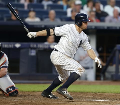 Jun 11, 2016; Bronx, NY, USA; New York Yankees left fielder Brett Gardner (11) follows through on a single in the third inning against the Detroit Tigers at Yankee Stadium. Mandatory Credit: Noah K. Murray-USA TODAY Sports