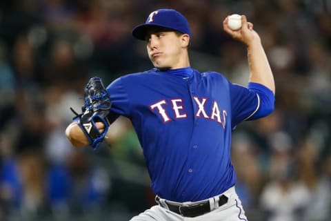 Sep 8, 2016; Seattle, WA, USA; Texas Rangers starting pitcher Derek Holland (45) throws against the Seattle Mariners during the second inning at Safeco Field. Mandatory Credit: Joe Nicholson-USA TODAY Sports