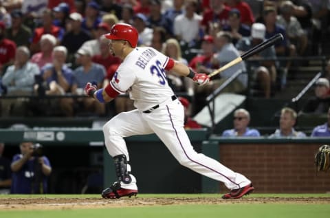 Sep 21, 2016; Arlington, TX, USA; Texas Rangers right fielder Carlos Beltran (36) hits a two run home run during the fifth inning against the Los Angeles Angels at Globe Life Park in Arlington. Mandatory Credit: Kevin Jairaj-USA TODAY Sports