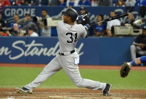 Sep 26, 2016; Toronto, Ontario, CAN; New York Yankees right fielder Aaron Hicks (31) hits a two run home run against Toronto Blue Jays in the ninth inning at Rogers Centre. Mandatory Credit: Dan Hamilton-USA TODAY Sports