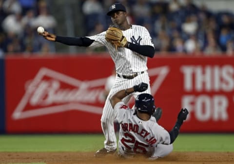 Sep 27, 2016; Bronx, NY, USA; New York Yankees shortstop Didi Gregorius (18) turns a double play on Boston Red Sox center fielder Jackie Bradley Jr. (25) during the fifth inning at Yankee Stadium. Mandatory Credit: Adam Hunger-USA TODAY Sports