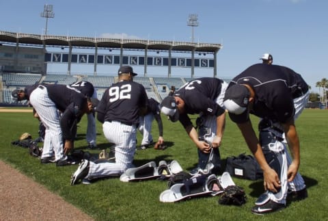 Feb 20, 2016; Tampa, FL, USA; New York Yankees catchers put on their gear during practice at George M. Steinbrenner Stadium. Mandatory Credit: Butch Dill-USA TODAY Sports