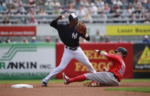 Mar 5, 2016; Tampa, FL, USA; New York Yankees shortstop Jorge Mateo (93) forces out Boston Red Sox second baseman Brock Holt (12) and throws the ball to first base for a double play during the first inning at George M. Steinbrenner Field. Mandatory Credit: Kim Klement-USA TODAY Sports