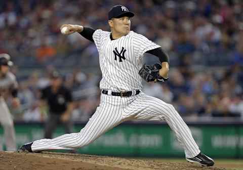 Jul 22, 2016; Bronx, NY, USA; New York Yankees starting pitcher Masahiro Tanaka (19) pitches during the fourth inning of an inter-league baseball game against the San Francisco Giants at Yankee Stadium. Mandatory Credit: Adam Hunger-USA TODAY Sports