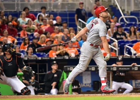 Jul 30, 2016; Miami, FL, USA; St. Louis Cardinals left fielder Matt Holliday (7) connects for a base hit during the eighth inning against the Miami Marlins at Marlins Park. Marlins won 11-0. Mandatory Credit: Steve Mitchell-USA TODAY Sports