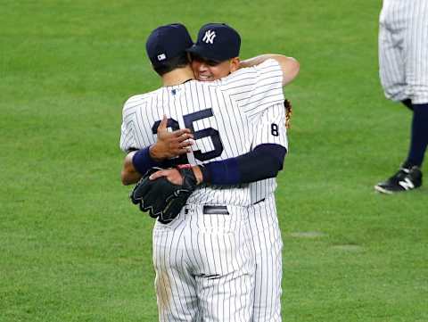 Aug 12, 2016; Bronx, NY, USA; New York Yankees designated hitter Alex Rodriguez (13) is hugged by first baseman Mark Teixeira (25) after Rodriguez was taken out of the game after playing third base against the Tampa Bay Rays during the ninth inning at Yankee Stadium. The Yankees won 6-3. Mandatory Credit: Andy Marlin-USA TODAY Sports