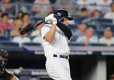 Aug 26, 2016; Bronx, NY, USA; New York Yankees center fielder Jacoby Ellsbury (22) hits an RBI single against the Baltimore Orioles during the second inning at Yankee Stadium. Mandatory Credit: Andy Marlin-USA TODAY Sports