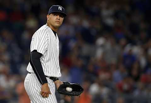 Sep 14, 2016; Bronx, NY, USA; New York Yankees relief pitcher Dellin Betances (68) reacts after committing a throwing error during the ninth inning against the Los Angeles Dodgers at Yankee Stadium. Mandatory Credit: Adam Hunger-USA TODAY Sports