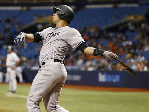 Sep 21, 2016; St. Petersburg, FL, USA; New York Yankees catcher Gary Sanchez (24) hits a home run during the sixth inning against the Tampa Bay Rays at Tropicana Field. Mandatory Credit: Kim Klement-USA TODAY Sports