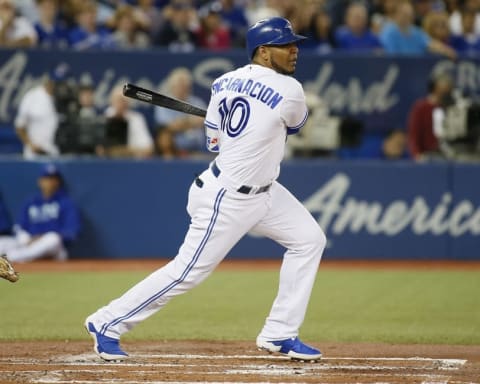 Sep 23, 2016; Toronto, Ontario, CAN; Toronto Blue Jays first baseman Edwin Encarnacion (10) singles in the first inning against the New York Yankees at Rogers Centre. Mandatory Credit: John E. Sokolowski-USA TODAY Sports