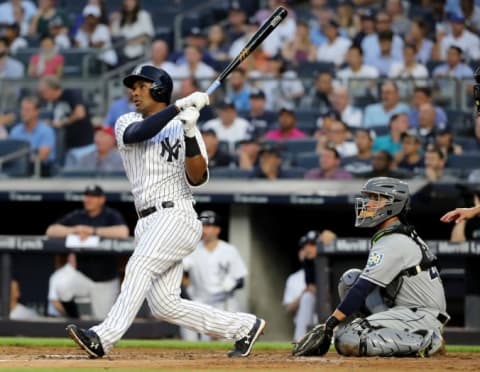 NEW YORK, NY – AUGUST 15: Miguel Andujar #41 of the New York Yankees hits a solo home run as Michael Perez #43 of the Tampa Bay Rays defends in the second inning at Yankee Stadium on August 15, 2018 in the Bronx borough of New York City. (Photo by Elsa/Getty Images)