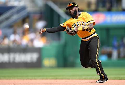 PITTSBURGH, PA – AUGUST 19: Josh Harrison #5 of the Pittsburgh Pirates throws to first base to force out Javier Baez #9 of the Chicago Cubs in the sixth inning during the game at PNC Park on August 19, 2018 in Pittsburgh, Pennsylvania. (Photo by Justin Berl/Getty Images)