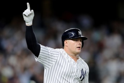 NEW YORK, NEW YORK – OCTOBER 03: Luke Voit #45 of the New York Yankees celebrates after hitting two RBI triple against the Oakland Athletics during the sixth inning in the American League Wild Card Game at Yankee Stadium on October 03, 2018 in the Bronx borough of New York City. (Photo by Elsa/Getty Images)