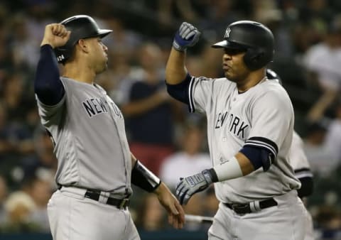 DETROIT, MI – SEPTEMBER 10: Edwin Encarnacion #30 of the New York Yankees (R) celebrates with Gary Sanchez #24 after hitting a two-run home run to tie the game against the Detroit Tigers at 10-10 during the seventh inning at Comerica Park on September 10, 2019 in Detroit, Michigan. (Photo by Duane Burleson/Getty Images)