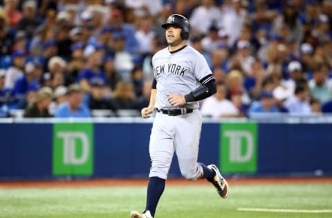 TORONTO, ON - SEPTEMBER 15: Austin Romine #28 of the New York Yankees scores a run in the seventh inning during a MLB game against the Toronto Blue Jays at Rogers Centre on September 15, 2019 in Toronto, Canada. (Photo by Vaughn Ridley/Getty Images)