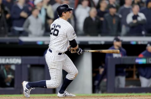 NEW YORK, NEW YORK - OCTOBER 04: DJ LeMahieu #26 of the New York Yankees hits a double to left field to score Didi Gregorius #18, Cameron Maybin #38 and Gleyber Torres #25 against the Minnesota Twins during the seventh inning in game one of the American League Division Series at Yankee Stadium on October 04, 2019 in New York City. (Photo by Elsa/Getty Images)