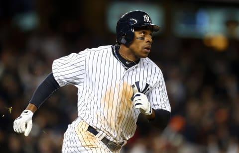 NEW YORK, NY – OCTOBER 12: (NEW YORK DAILIES OUT) Curtis Granderson #14 of the New York Yankees runs the bases after seventh inning home run against the Baltimore Orioles during Game Five of the American League Division Series at Yankee Stadium on October 12, 2012 in the Bronx borough of New York City. The Yankees defeated the Orioles 3-1 to win their best of five series three games to two. (Photo by Jim McIsaac/Getty Images)