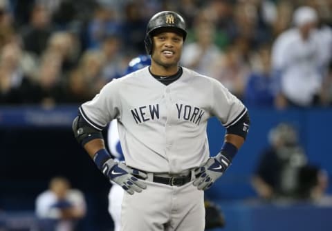 TORONTO, CANADA – SEPTEMBER 18: Robinson Cano #24 of the New York Yankees reacts after his groundball just stayed fair resulting in a groundout in the sixth inning during MLB game action against the Toronto Blue Jays on September 18, 2013 at Rogers Centre in Toronto, Ontario, Canada. (Photo by Tom Szczerbowski/Getty Images)