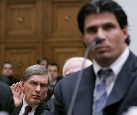 WASHINGTON – MARCH 17: Major League Baseball Commissioner Allan “Bud” Selig (L) cups his ear to listen to the testimony of former Major League Baseball player Jose Canseco during a House Committe session investigating Major League Baseball’s effort to eradicate steroid use on Capitol Hill March 17, 2005 in Washington, DC. Major League Baseball (MLB) Commissioner Allen “Bud” Selig will give testimony regarding MLB?s efforts to eradicate steriod usage among its players. (Photo by Mark Wilson/Getty Images)