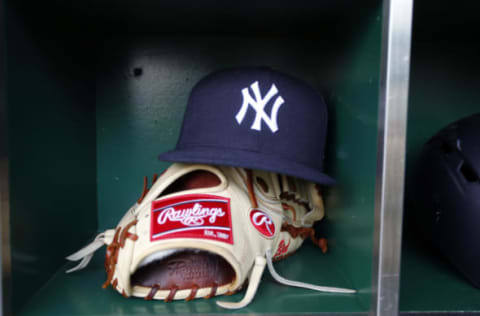 PITTSBURGH, PA – APRIL 21: A New York Yankees hat and Rawlings baseball glove is seen during the game against the Pittsburgh Pirates at PNC Park on April 21, 2017 in Pittsburgh, Pennsylvania. (Photo by Justin K. Aller/Getty Images) *** Local Caption ***