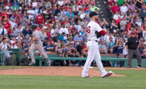 BOSTON, MA – JULY 15: Matt Holliday #17 of the New York Yankees hits a solo home run during the ninth inning to tie the game 1-1 off Craig Kimbrel #46 of the Boston Red Sox at Fenway Park on July 15, 2017 in Boston, Massachusetts. (Photo by Rich Gagnon/Getty Images)