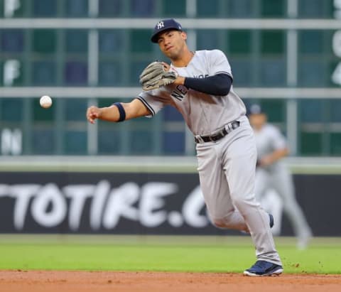 HOUSTON, TX – MAY 02: Gleyber Torres #25 of the New York Yankees throws out Carlos Correa of the Houston Astros in the first inning at Minute Maid Park on May 2, 2018 in Houston, Texas. (Photo by Bob Levey/Getty Images)