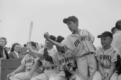 circa 1955: A bench of Little League baseball players are infuriated by an umpire’s decision. (Photo by Orlando /Three Lions/Getty Images)