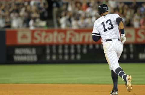 Alex Rodriguez homers. (Photo by Nick Laham/Getty Images)