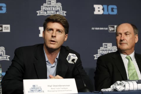 NEW YORK, NY – JUNE 3: Hal Steinbrenner, Managing General Partner of the New York Yankees (L) and Jim Delany, Commissioner of the Big Ten Conference addresses the media during a press conference to announce the New Era Pinstripe Bowl’s eight-year partnership with the Big Ten Conference at Yankees Stadium on June 3, 2013 in the Bronx borough of New York City. (Photo by Jason Szenes/Getty Images