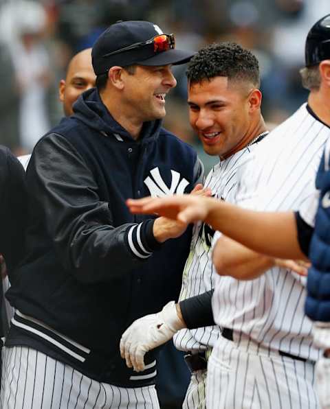 NEW YORK, NY – MAY 06: Gleyber Torres #25 of the New York Yankees celebrartes his ninth inning game-winning three-run home run against the Cleveland Indians with manager Aaron Boone at Yankee Stadium on May 6, 2018 in the Bronx borough of New York City. (Photo by Jim McIsaac/Getty Images)