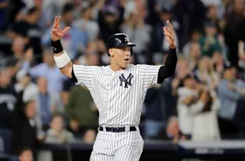 NEW YORK, NEW YORK – OCTOBER 03: Aaron Judge #99 of the New York Yankees celebrates after scoring a run off of a double hit by Aaron Hicks #31 during the sixth inning against the Oakland Athletics in the American League Wild Card Game at Yankee Stadium on October 03, 2018 in the Bronx borough of New York City. (Photo by Elsa/Getty Images)