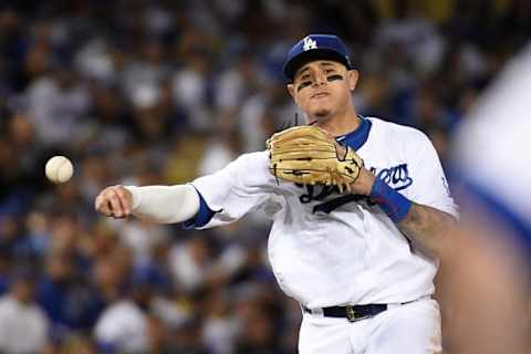 LOS ANGELES, CA – OCTOBER 15: Manny Machado #8 of the Los Angeles Dodgers throws out Ryan Braun #8 of the Milwaukee Brewers (not in photo) during the sixth inning of Game Three of the National League Championship Series at Dodger Stadium on October 15, 2018 in Los Angeles, California. (Photo by Kevork Djansezian/Getty Images)