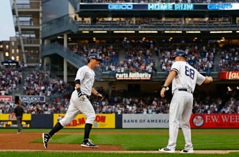 NEW YORK, NY – JUNE 17: DJ LeMahieu #26 of the New York Yankees celebrates with Phil Nevin #88 of the New York Yankees after hitting a two run home run against the Tampa Bay Rays during the third inning at Yankee Stadium on June 17, 2019 in the Bronx borough of New York City. (Photo by Adam Hunger/Getty Images)