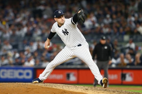 NEW YORK, NEW YORK - OCTOBER 15: Adam Ottavino #0 of the New York Yankees pitches during the seventh inning against the Houston Astros in game three of the American League Championship Series at Yankee Stadium on October 15, 2019 in New York City. (Photo by Mike Stobe/Getty Images)