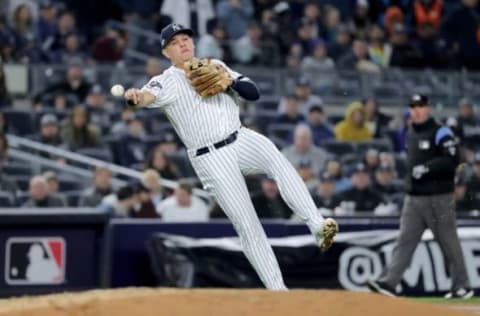 NEW YORK, NEW YORK – OCTOBER 18: Gio Urshela #29 of the New York Yankees fields a play hit by Yuli Gurriel #10 of the Houston Astros during the eighth inning in game five of the American League Championship Series at Yankee Stadium on October 18, 2019 in New York City. (Photo by Elsa/Getty Images)