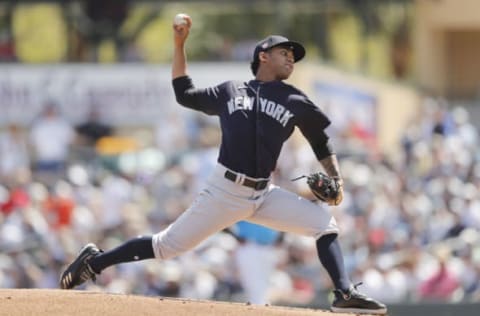 JUPITER, FLORIDA – MARCH 11: Deivi Garcia #83 of the New York Yankees delivers a pitch against the Miami Marlins during a Grapefruit League spring training at Roger Dean Stadium on March 11, 2020 in Jupiter, Florida. (Photo by Michael Reaves/Getty Images)